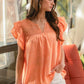 Brianna Orange Ruffle Top